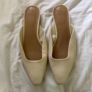 Cream slide on sandal